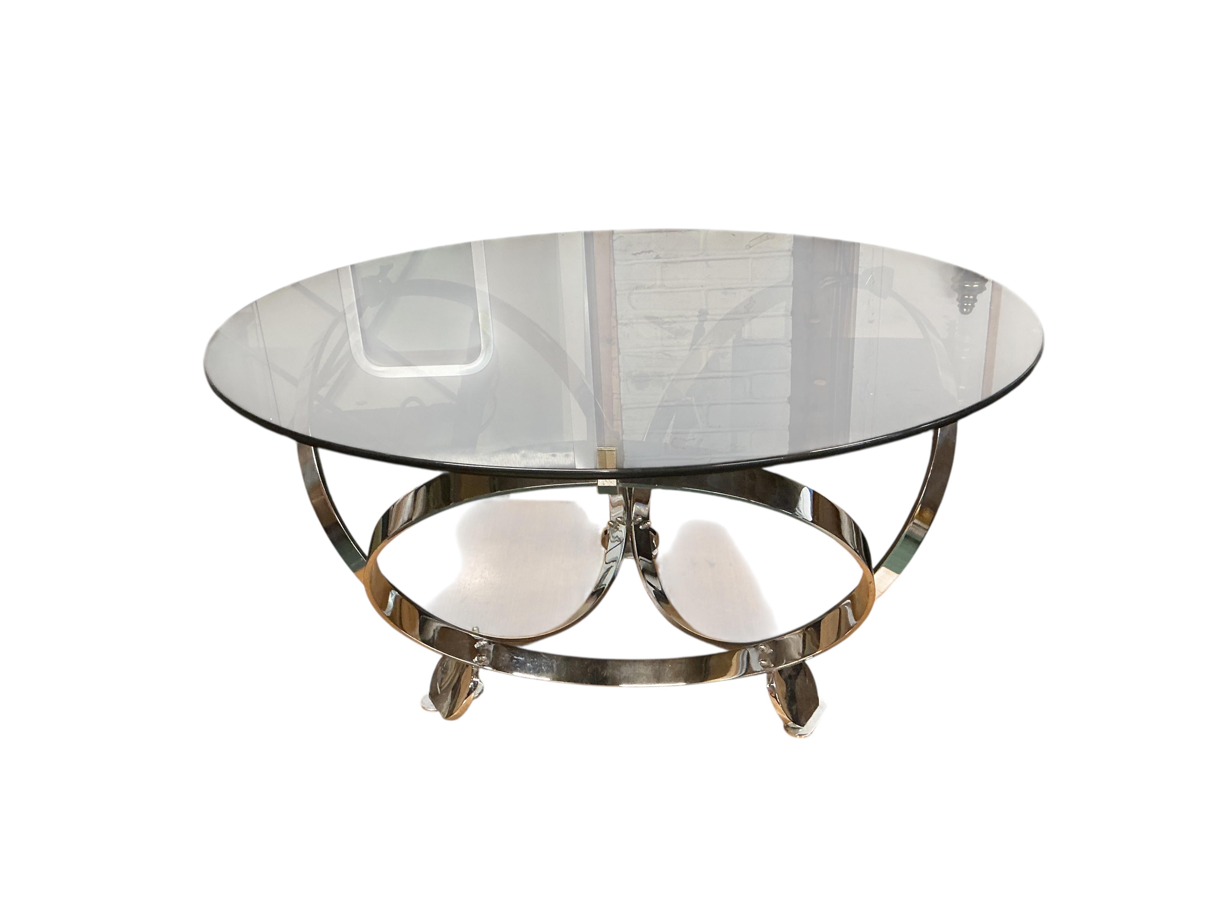 A 1960's KNNT Hesterberg circular chrome and glass top coffee table, diameter 100cm, height 52cm